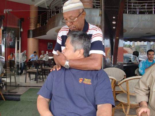 Alaoui Sensei works his skillful massage techniques on Homma Kancho.