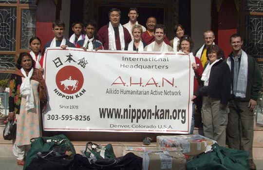 Nippon Kan Delegation with donated school supplies.