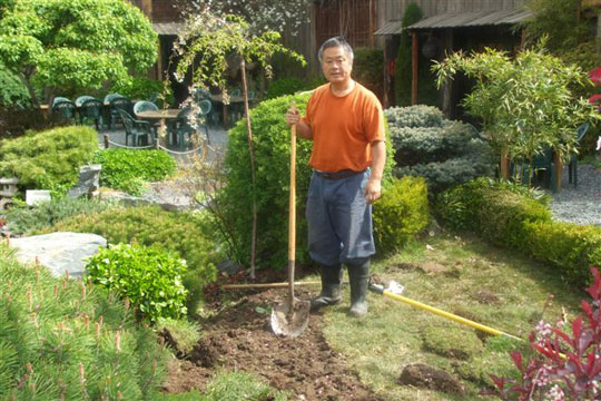 Homma Kancho taking care of the Nippon Kan garden.