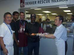 The 40,000 meal served to Mr. Alan Campbell by Consul General Ota.