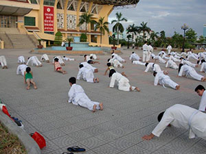Karate practice outside in the heat and humidity.