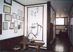 Two Walls With a Lard Painting and Smaller Artworks