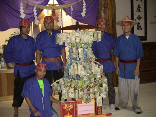 Rakhine staff at Nippon Kan in Denver collecting donations with a Myanmar traditional money tree