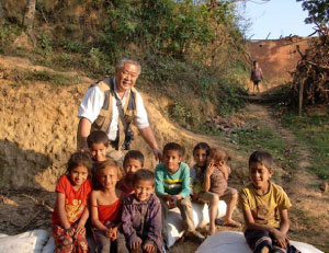 A Man Standing With a Group of Children